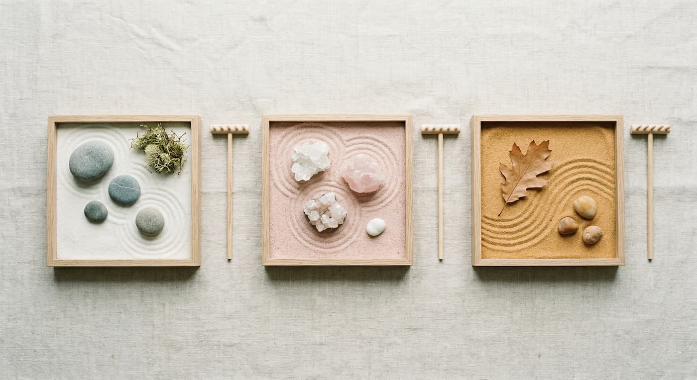 Visual examples of sand arrangements for How to Choose a Zen Garden with rocks and natural elements.