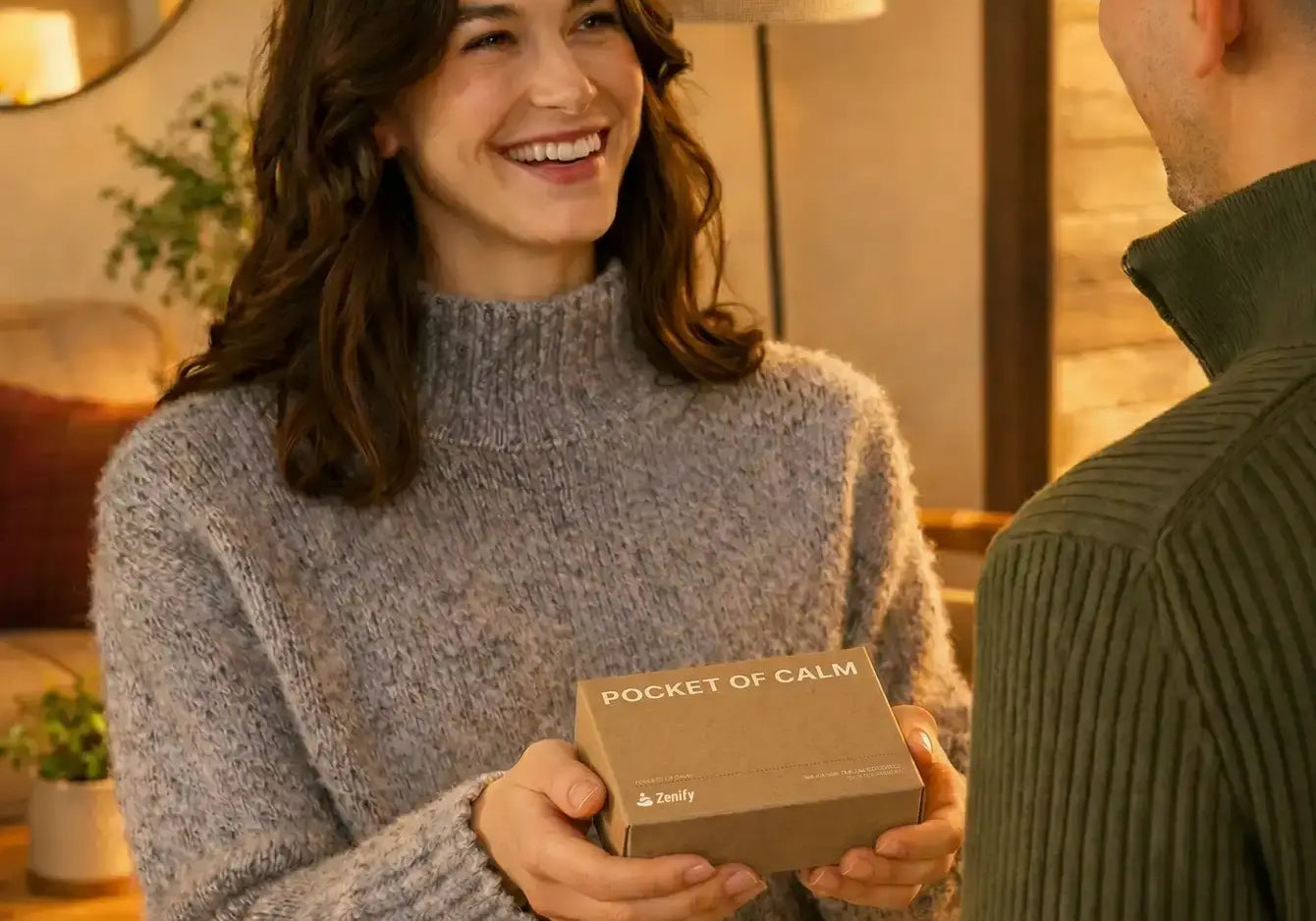 A woman giving a Pocket of Calm mini Zen garden gift box to a friend