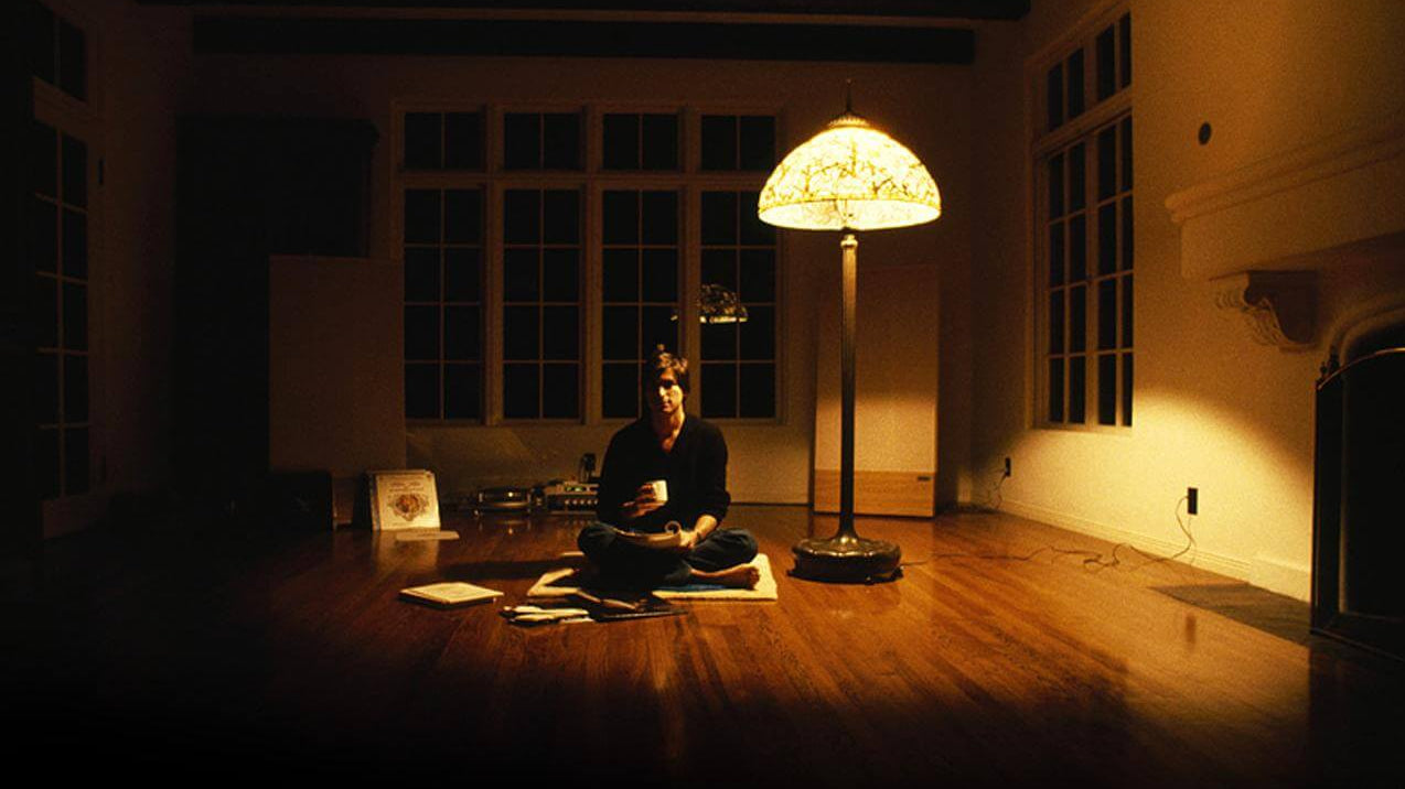 Meditating in a dimly lit room, illustrating the theme: Something Shocking Happens When You Meditate For Long Enough