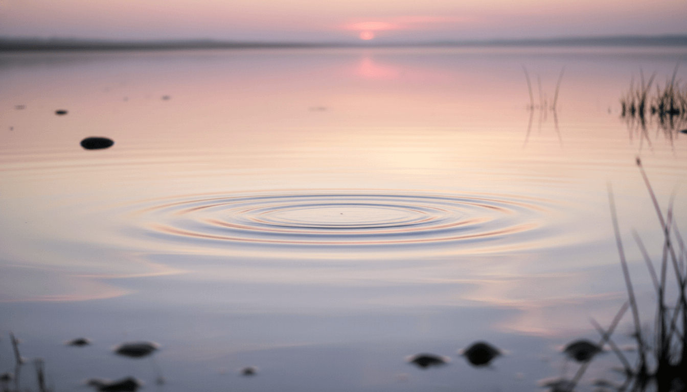 Embrace the Zenify Lifestyle: serene water ripples at sunset reflecting tranquility and calmness.