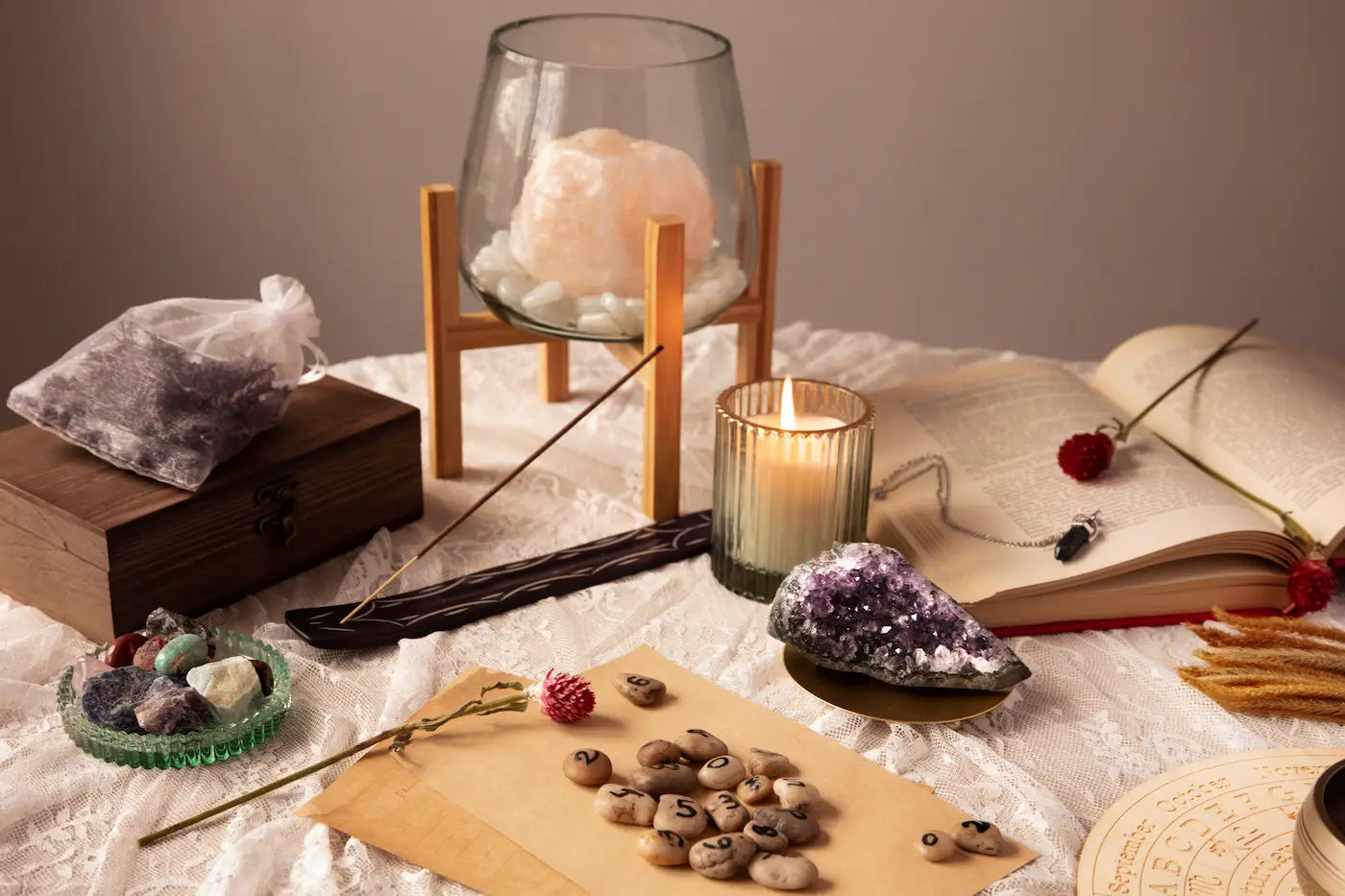A candlelit arrangement of stones used as visual meditation attention anchors