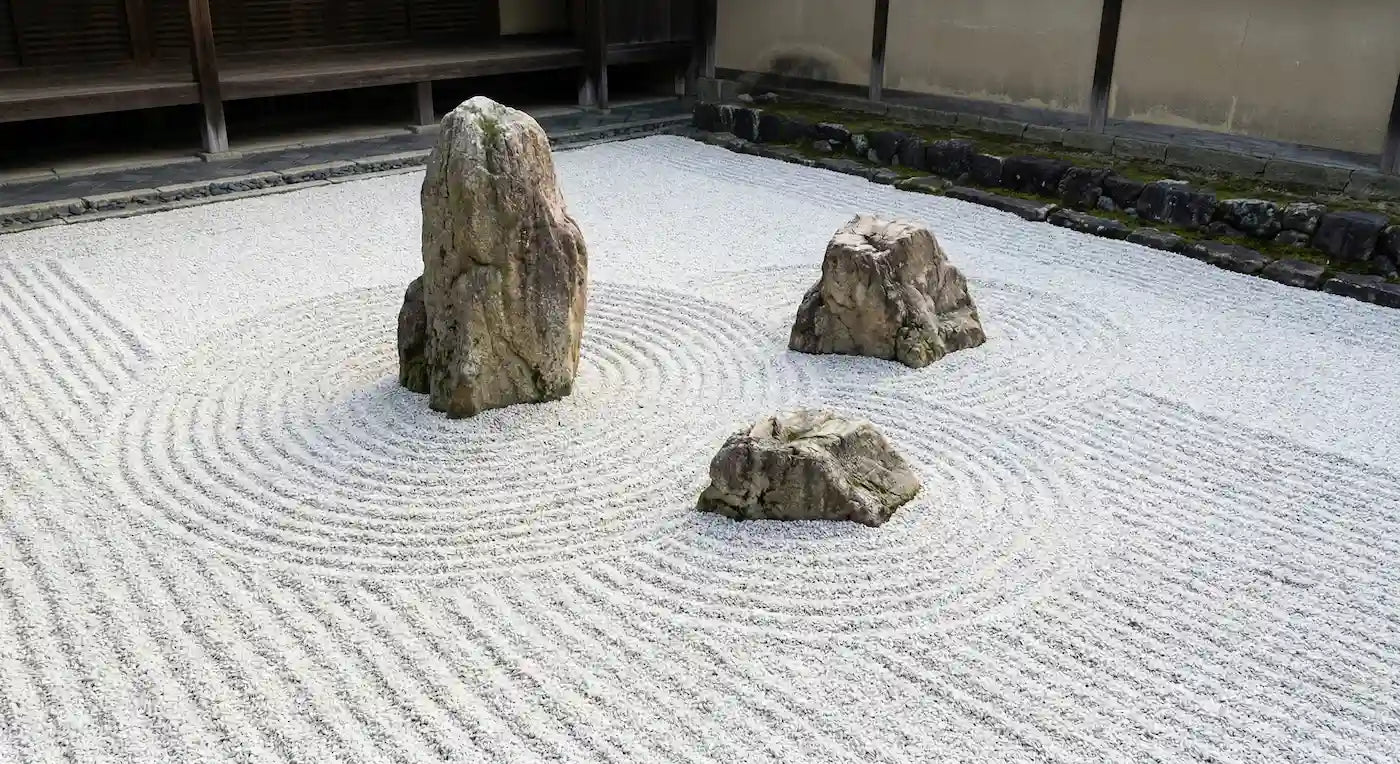 The Soul of Karesansui: Japanese Zen garden featuring carefully raked gravel and strategically placed rocks.