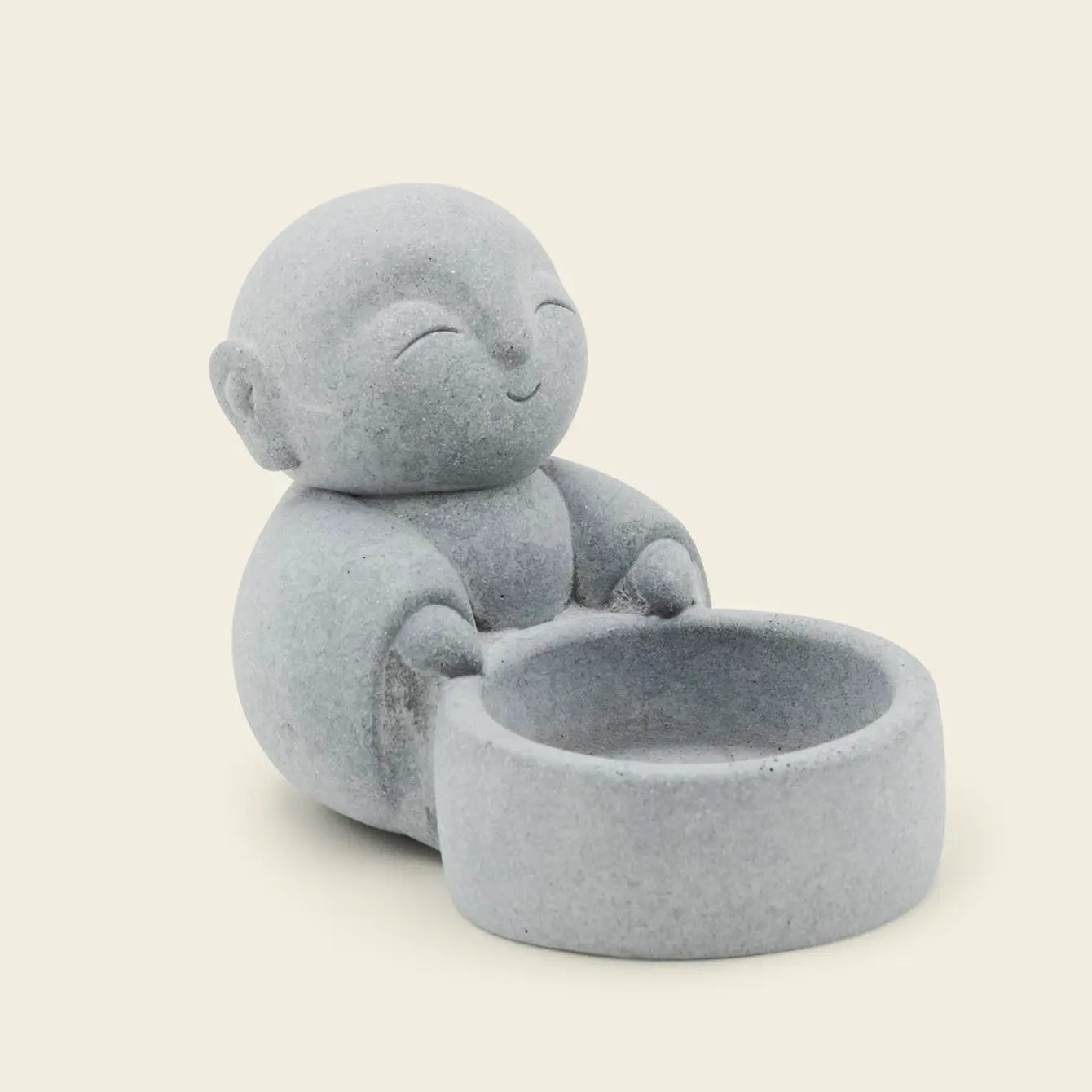 Zen-Stone Jizo Monk cement figurine with a joyful expression and a small bowl, perfect for Zen decor.