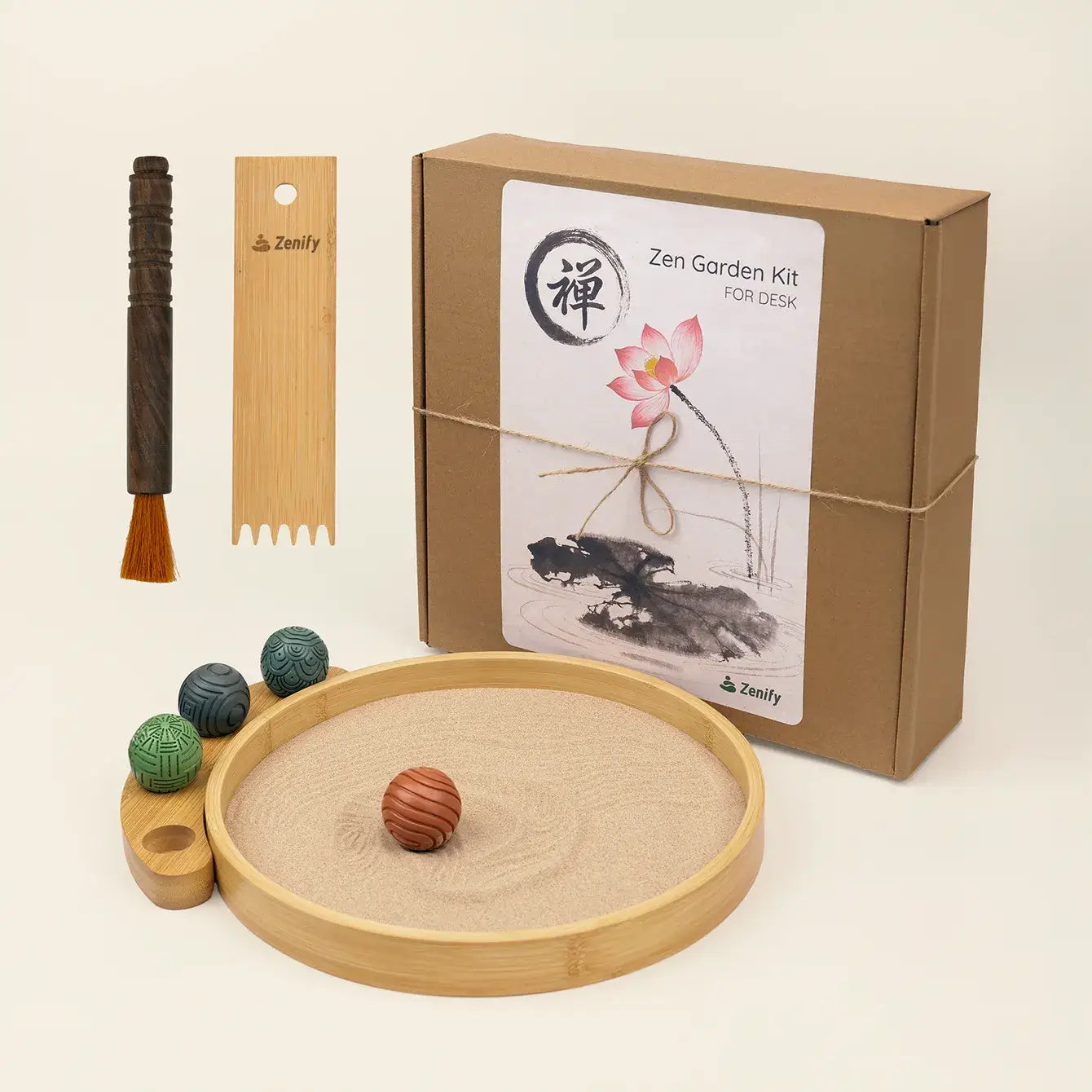 Desktop Zen Garden kit featuring bamboo sand tray, rake, brush, and decorative stones for desk relaxation.