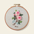 5-Hour Mindfulness Embroidery Kit featuring a floral design of pink roses in an embroidery hoop.