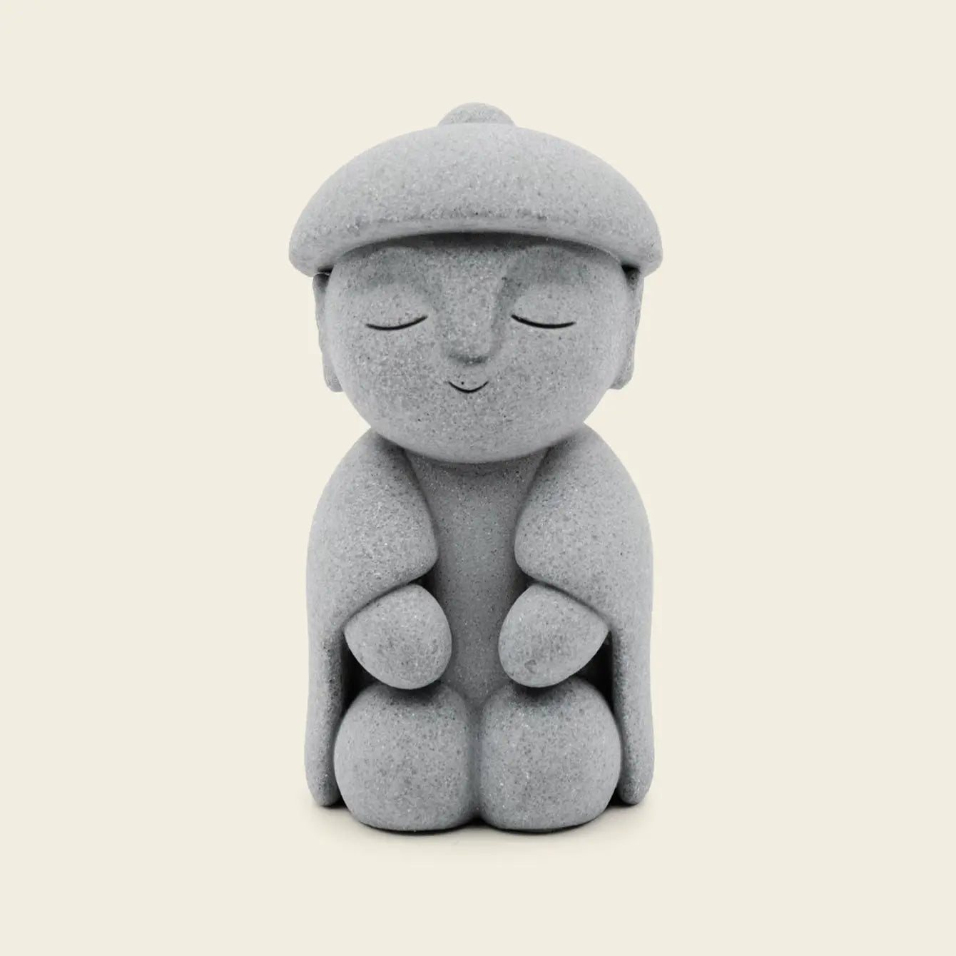 Zen-Stone: Jizo Monk cement figurine with a serene expression, designed for home decor and tranquility.