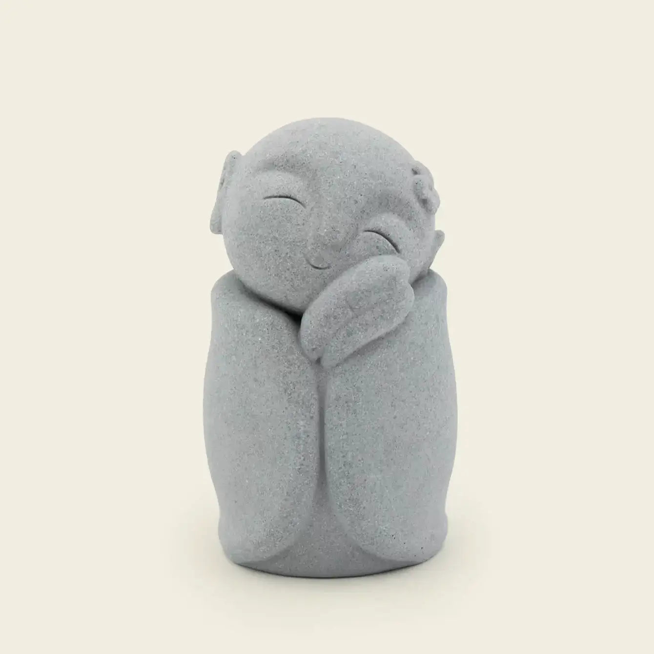 Zen-Stone Jizo Monk cement figurine, a smiling gray statue, representing tranquility and peace.