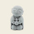 Zen-Stone Jizo Monk Cement Figurine collection displaying a serene monk holding a small figure in a meditative pose.