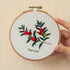 5-Hour Mindfulness Embroidery Kit featuring a floral design in a wooden hoop held by a hand.