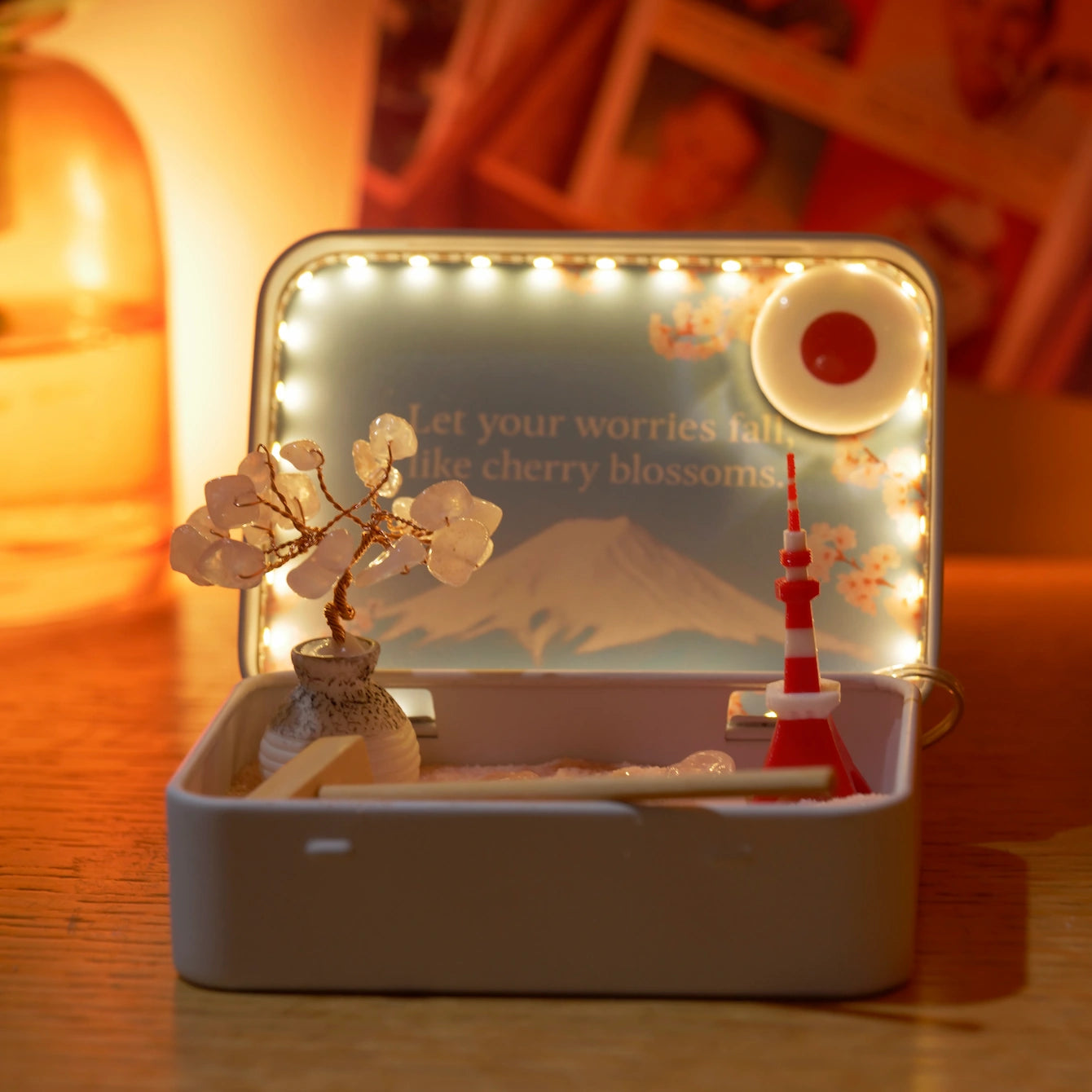 Tokyo Sakura Crystal Zen Garden with lit background, featuring a cherry blossom tree, Mount Fuji, and a red tower.