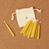 Portable meditation candle set featuring natural beeswax candles and a drawstring pouch for easy storage.