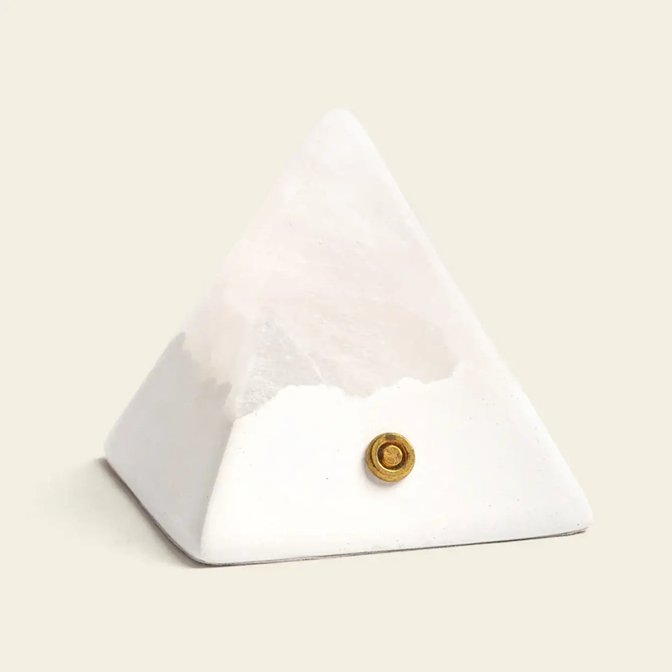 Mineral Pyramid Stone Lamp showcasing a calming glow with natural stone design on a neutral background.