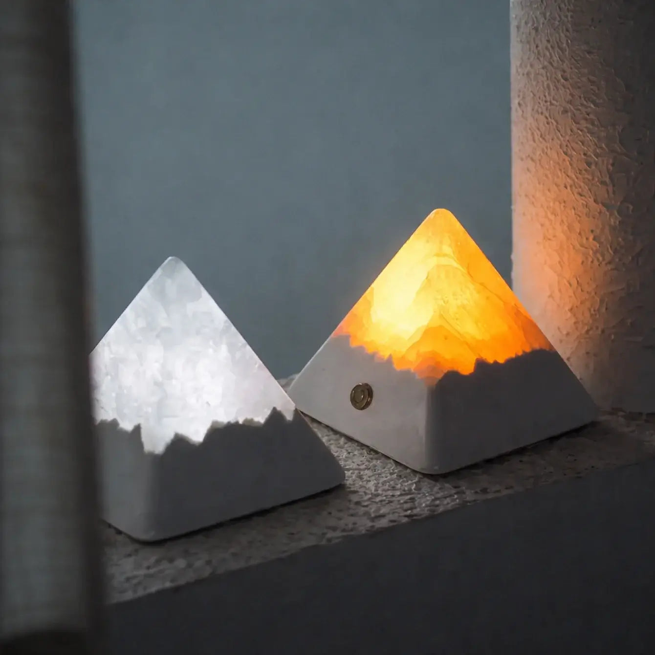 Mineral Pyramid Stone Lamp illuminating a warm glow, enhancing calm ambiance for decor.