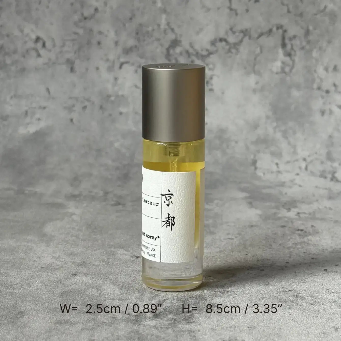 Portable Chakra Aromatherapy Mist for Yoga & Deep Meditation - 10ml bottle on a textured background.