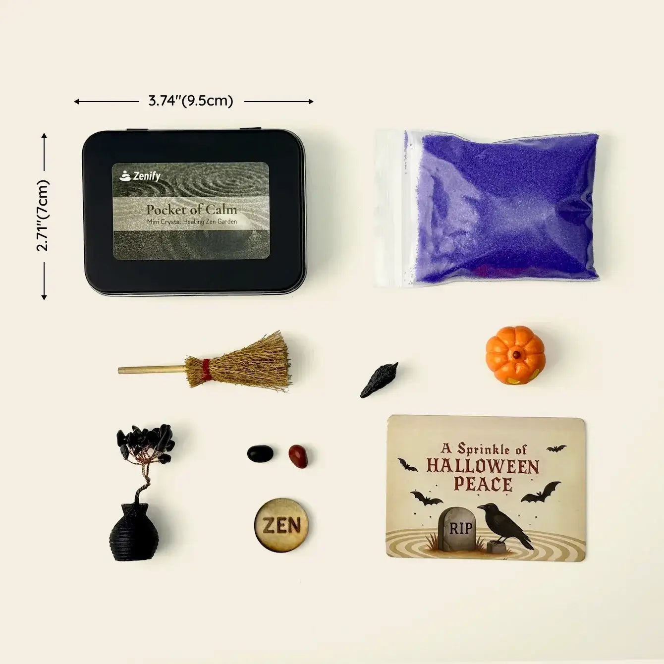 Zenify Halloween Obsidian Pocket Garden contents: obsidian crystal, mini pumpkin, purple sand, broom, raven decor, and peace card.