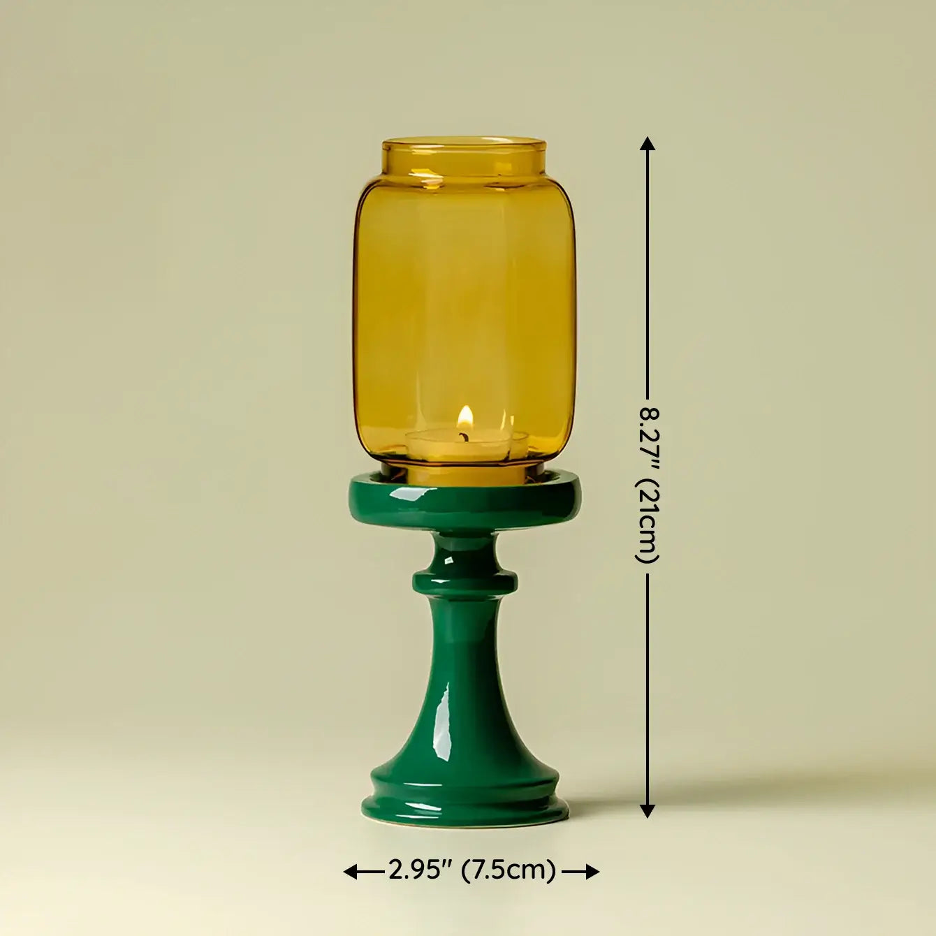 Yellow glass candle holder on a green stand with measurements indicated.
