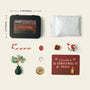 Zenify™ Christmas Zen Pocket Garden — a festive mini Zen set with a green aventurine tree, snowman, gift box, candy cane, and healing crystals on white sand.