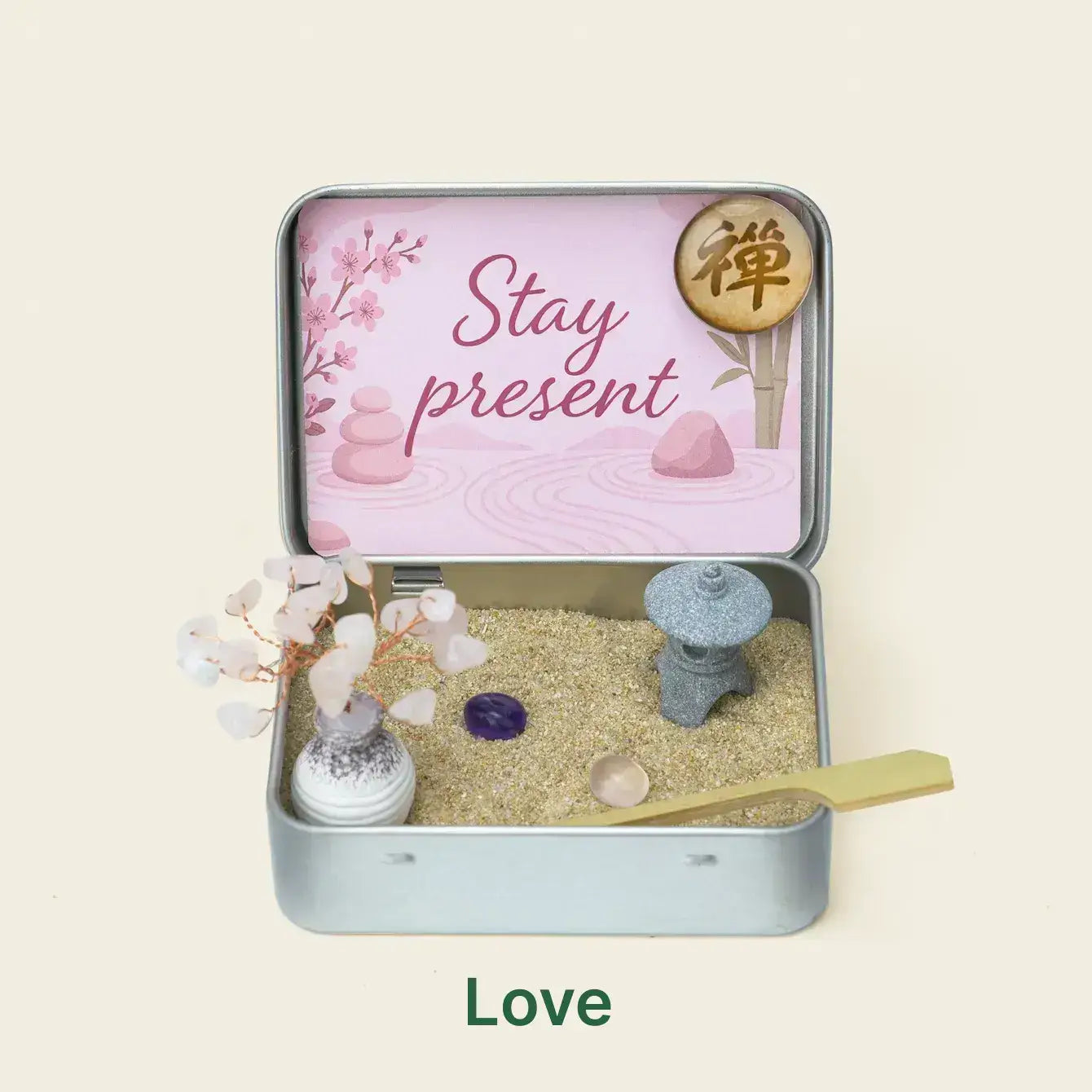 Japanese Crystal Zen Garden in a tin with a sand tray, decorative stones, and a message to stay present for mindfulness.