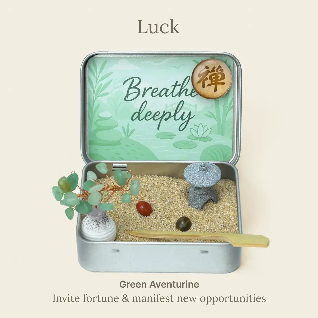 Japanese Crystal Zen Garden in a tin, featuring sand, stones, and a decorative tree for meditation and stress relief.