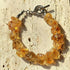 Natural Citrine Bracelet Jewelry showcasing raw citrine crystals on a textured surface.