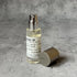 Portable Chakra Aromatherapy Mist for Yoga & Deep Meditation - 10ml bottle with spray cap on a textured surface.