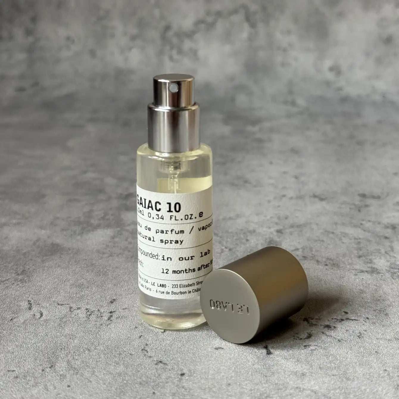 Portable Chakra Aromatherapy Mist for Yoga & Deep Meditation - 10ml bottle with spray cap on a textured surface.