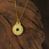 Circle of Harmony Necklace featuring a gold talisman pendant symbolizing balance and protection.
