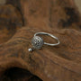 Zenify™ Silver Mantra Ring featuring intricate floral design, perfect for mindfulness and meditation.