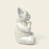 Zenify™ Meditating Dog white resin garden statue sitting peacefully with paws together.