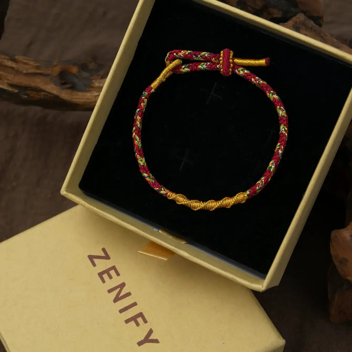 Zenify™ Fortune Knot handwoven lucky cord bracelet displayed in a gift box, symbolizing strength and intention.