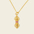 Vajra’s Power pendant necklace in gold with ruby accents, a sacred symbol of strength and calm.