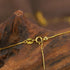 Close-up of the clasp of a gold necklace, highlighting the Italy 925 stamp for quality assurance.