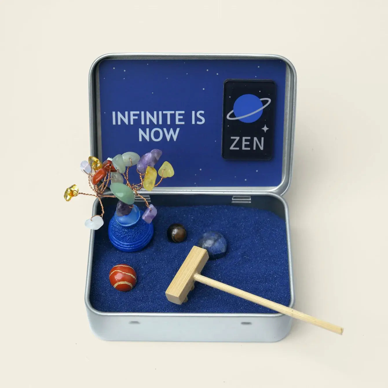 Zenify Cosmic Zen Crystal Garden in a tin with crystals, blue sand, and a hammer for mindful rituals.