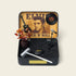 Elvis tribute crystal zen garden in a collectible tin with guitar, microphone, and decorative elements.