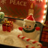 Christmas Crystal Zen Garden featuring a snowman, gift box, candy cane, and festive decor in a tranquil setting.