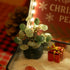 Christmas Crystal Zen Garden featuring a crystal tree and festive decorations in a tranquil sand setting.