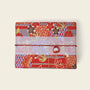 Wrapped gift block showcasing vibrant floral design, featuring gift wrapping options for orders.