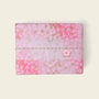Gift wrap featuring pink floral design, perfect for gift wrapping options for orders.