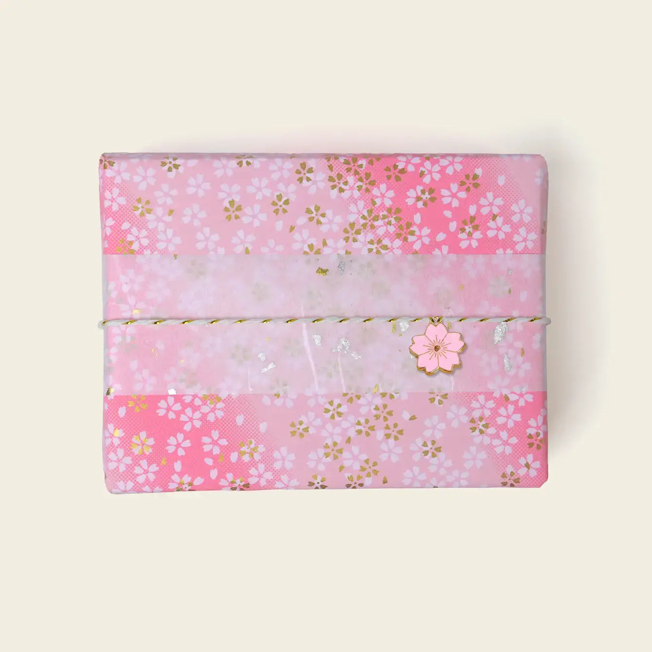 Gift wrap featuring pink floral design, perfect for gift wrapping options for orders.