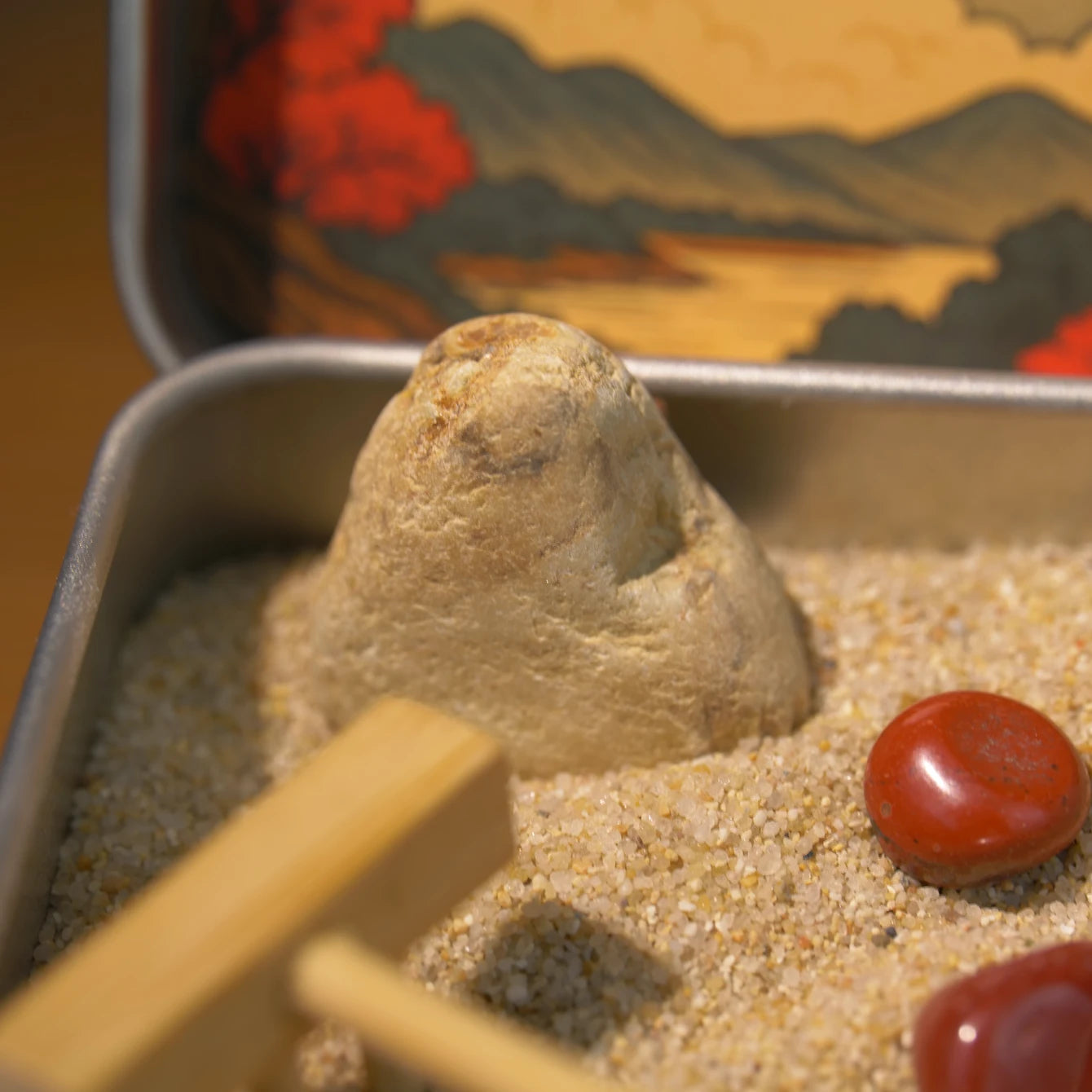 Red Leaf Zen Garden with natural stone, Red Jasper crystals, and sand tools inside a compact tin.