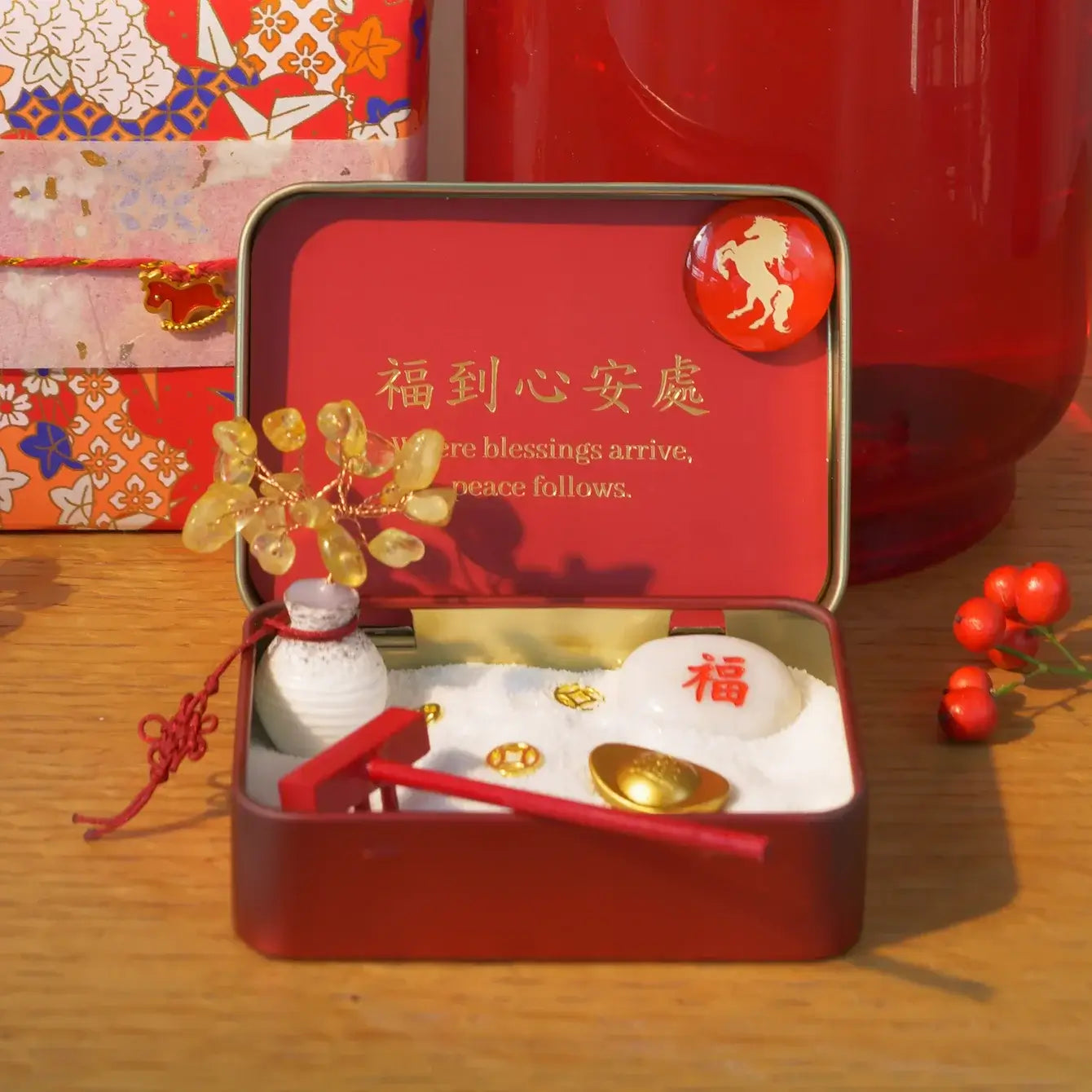 New Year Crystal Zen Garden featuring a citrine crystal tree and symbolic elements in a decorative red box.