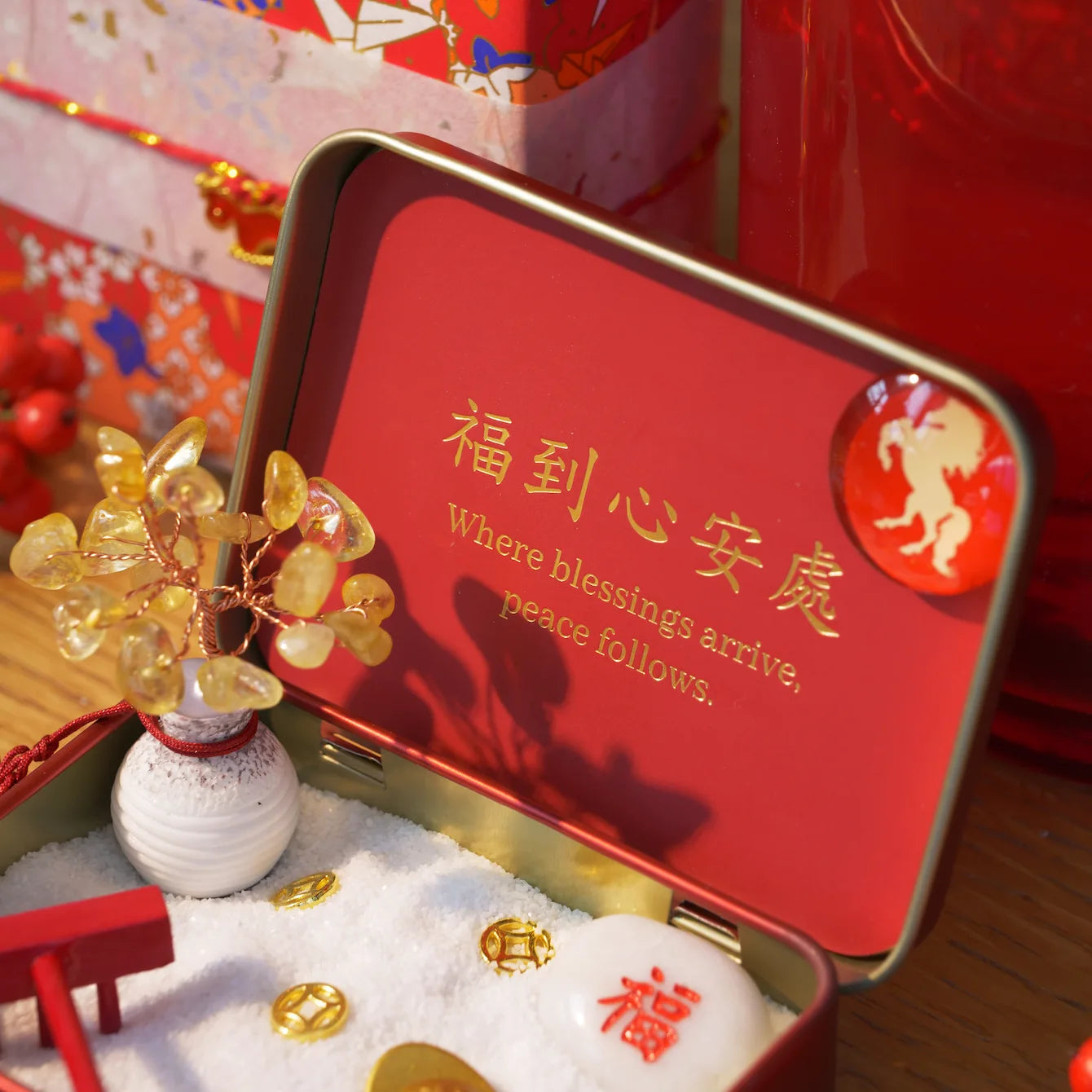 New Year Crystal Zen Garden featuring a citrine crystal tree and peaceful elements in a decorative tin.