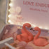 Love Endures Crystal Zen Garden featuring pink flamingos surrounded by soft pink sand and decorative elements.