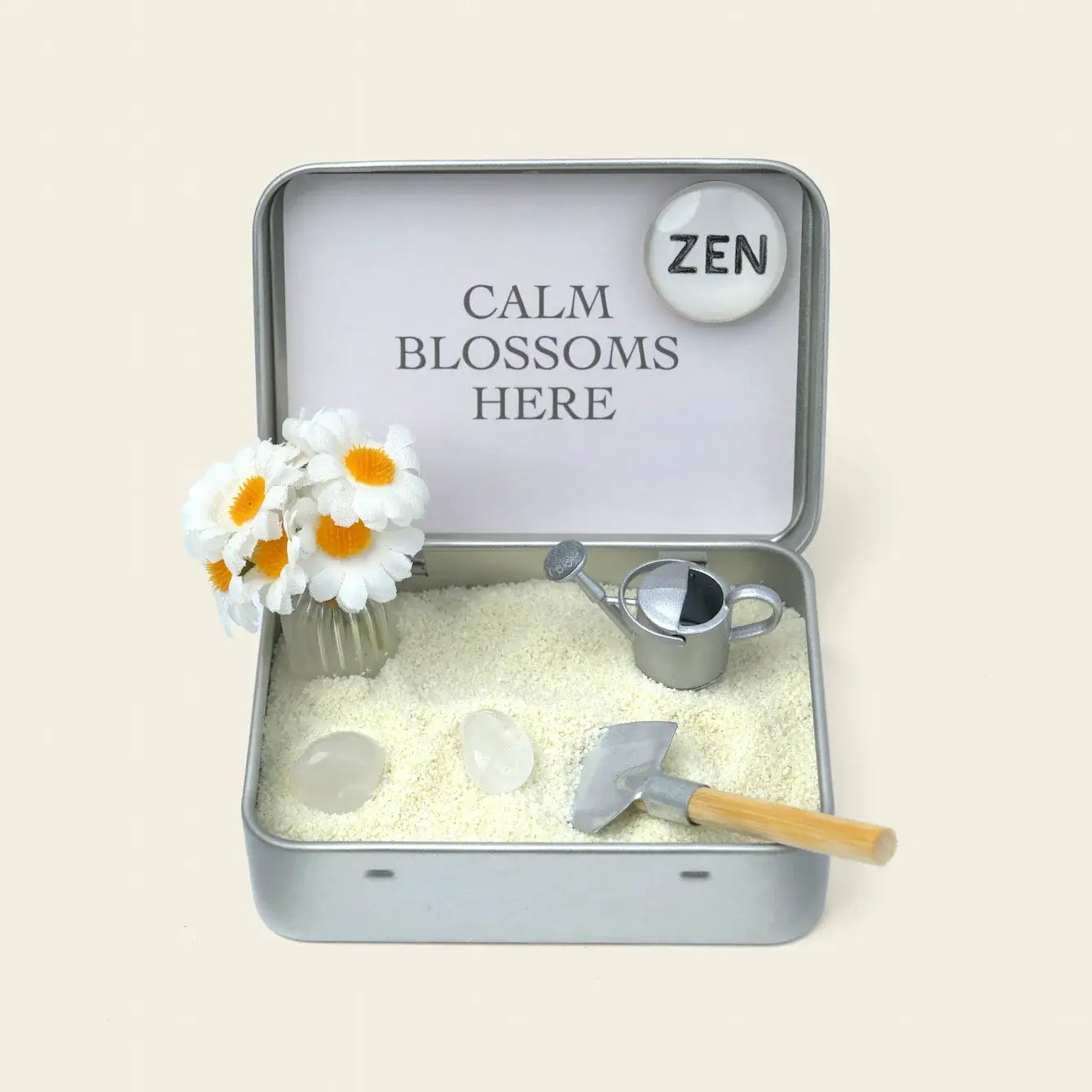 Zenify Blossom Zen Crystal Garden with flowers, watering can, and decorative elements in a serene tin setup.
