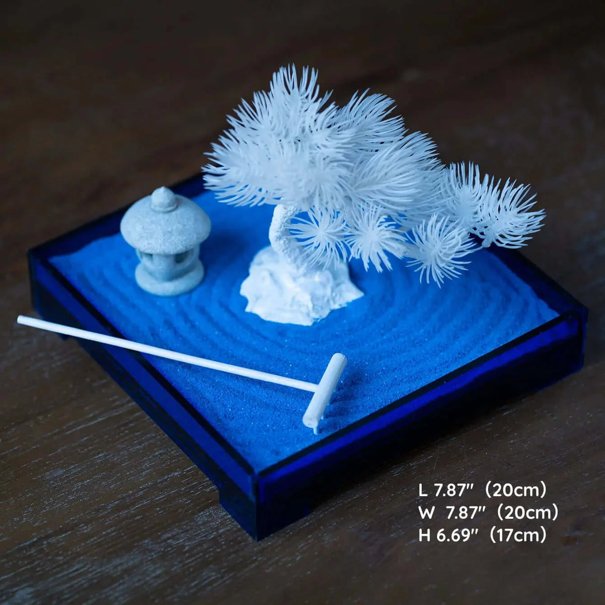 Blue Zen Garden set with deep blue sand, white pine tree, miniature stone lantern, white rake, and product dimensions.