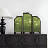 Decorative screen with nature design on a black cabinet against a white wall