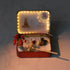 A glowing 12-Zodiac Crystal Zen Garden with a horse figurine, red flowers, and decorative sand.