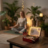 12-Zodiac Crystal Zen Garden – Personalized Meditation Kit with a person meditating and the kit on a table.