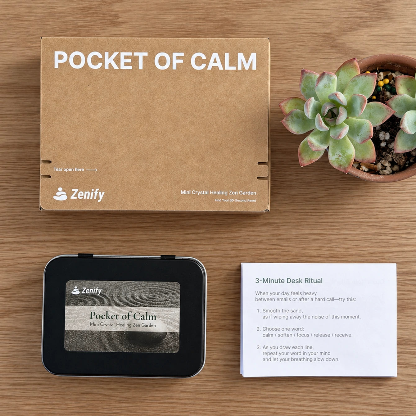 Zenify Pocket of Calm packaging box, closed metal tin and 3-Minute Desk Ritual instruction card on a wooden table.