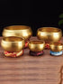 Real singing bowl demonstration showing several bowl sizes and how the wooden striker is used around the rim